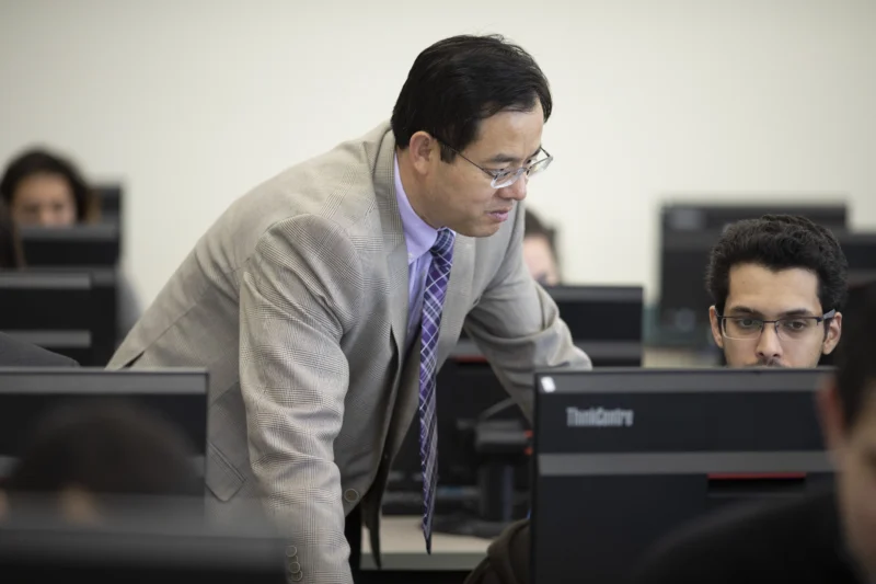 Dr Tong helping student