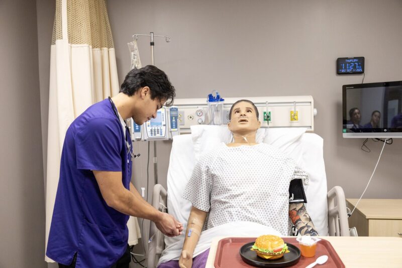 nursing student in sim lab