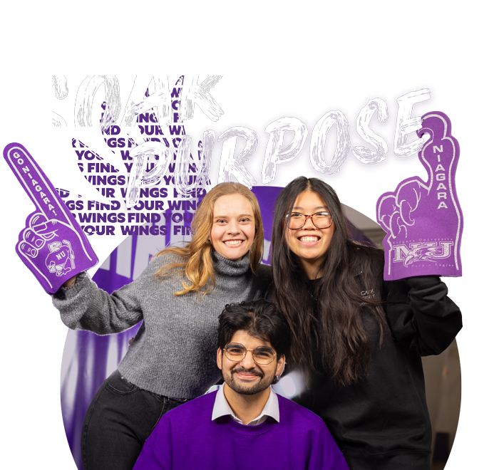 Three students smiling with two different foam fingers with the NU logo on them.