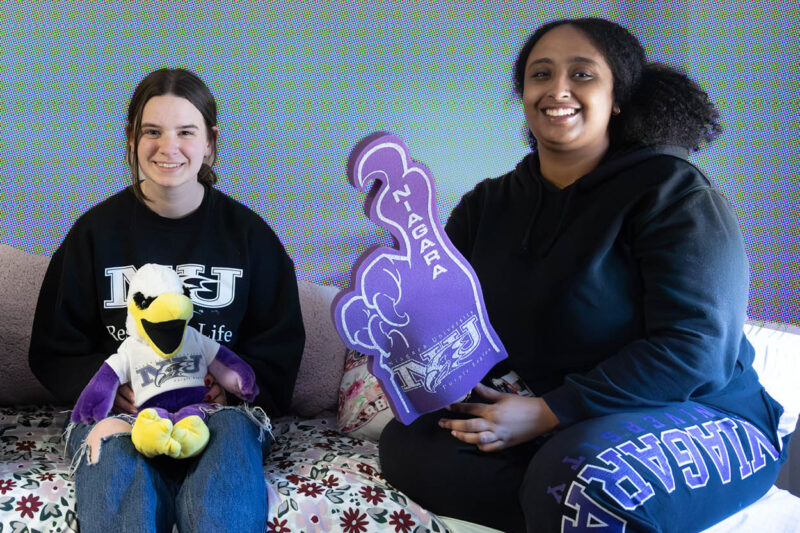 Students smiling in NU dorm