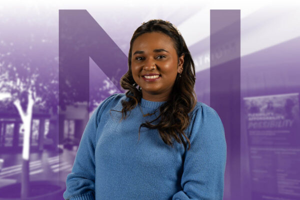 Smiling NU student at Grad Spring Open House