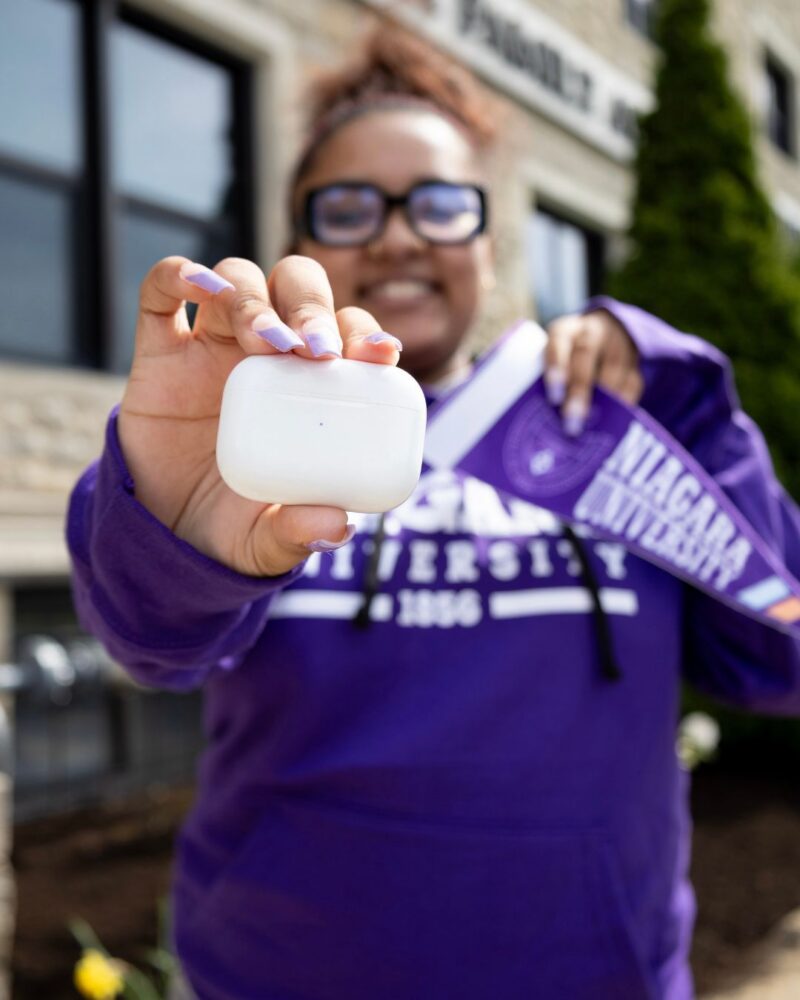 NU Student with AirPods