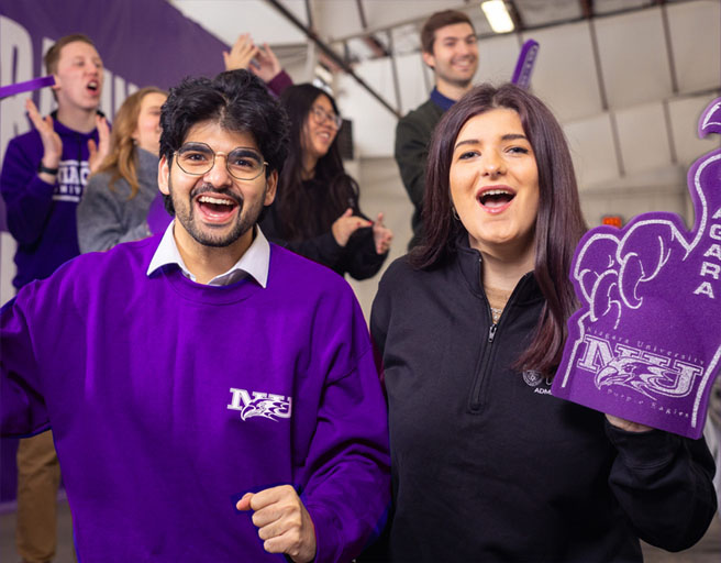 Q and Lauren cheering for NU