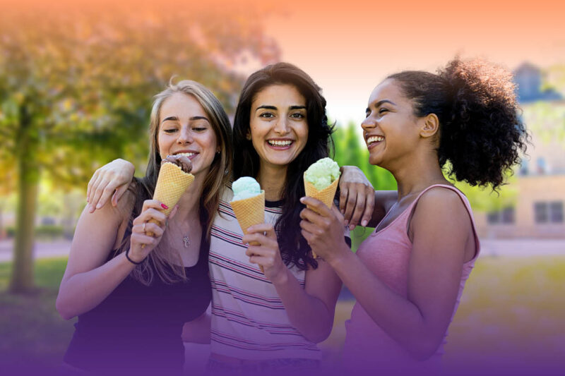 Three students eating ice cream on the NU campus