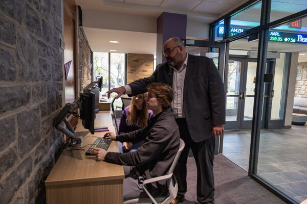Teacher helping student in Bieler computer room