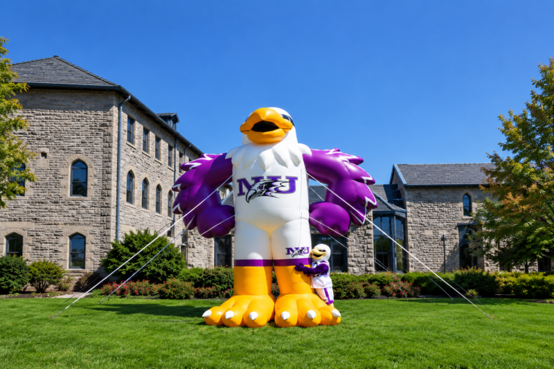 inflatable monte is being hugged by mascot monte